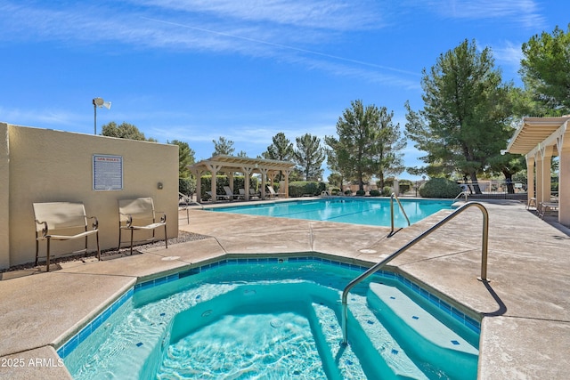 view of swimming pool featuring a pergola, a patio area, and a community hot tub