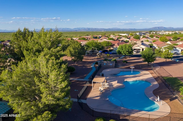 view of pool featuring a patio area and a mountain view