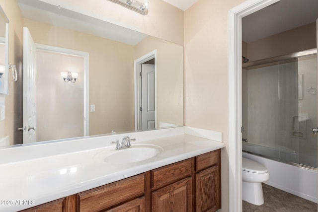 42160 W Arvada Ct, Maricopa, AZ 85138 - full bathroom with toilet, vanity, enclosed tub / shower combo, and tile patterned flooring