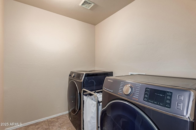 42160 W Arvada Ct, Maricopa, AZ 85138 - laundry room featuring washer and clothes dryer, baseboards, and tile patterned flooring