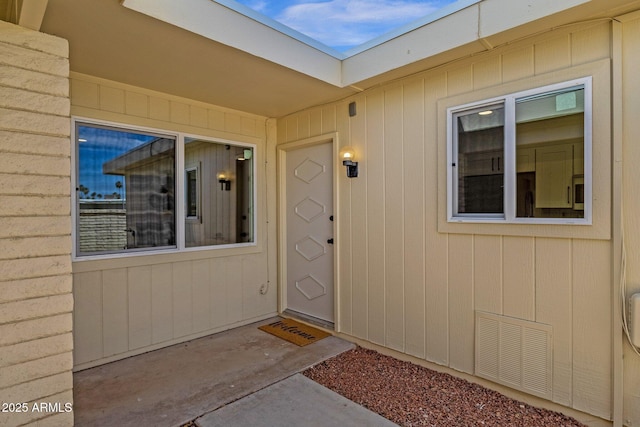view of exterior entry featuring visible vents