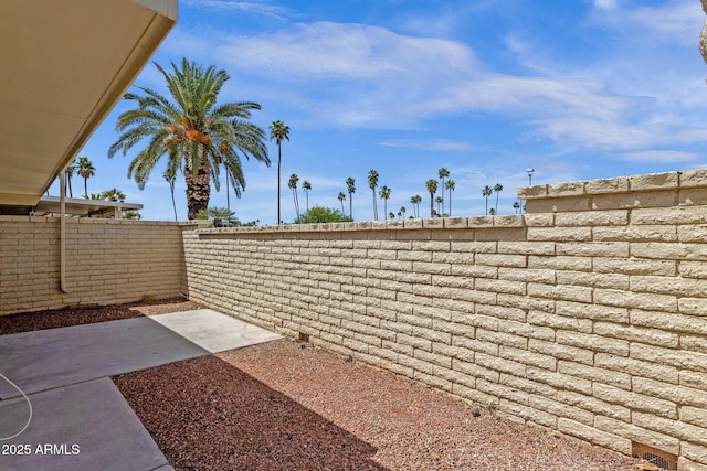 view of yard with fence and a patio area
