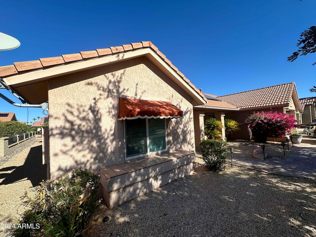 rear view of property with a patio area