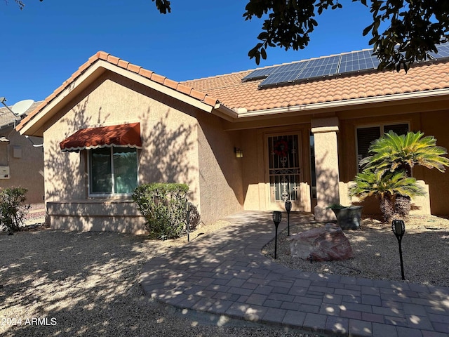 exterior space featuring solar panels