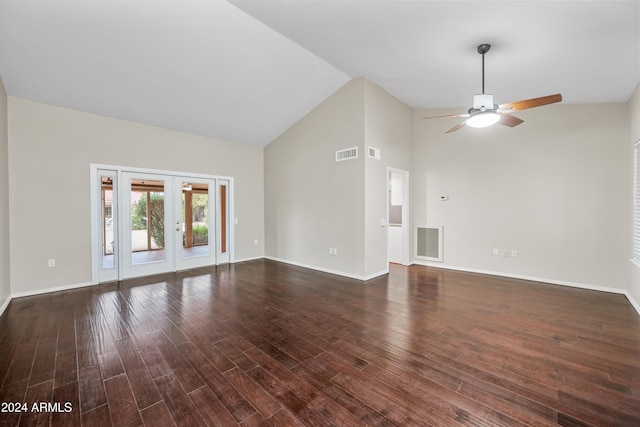 unfurnished living room featuring ceiling fan, dark hardwood / wood-style flooring, high vaulted ceiling, and french doors