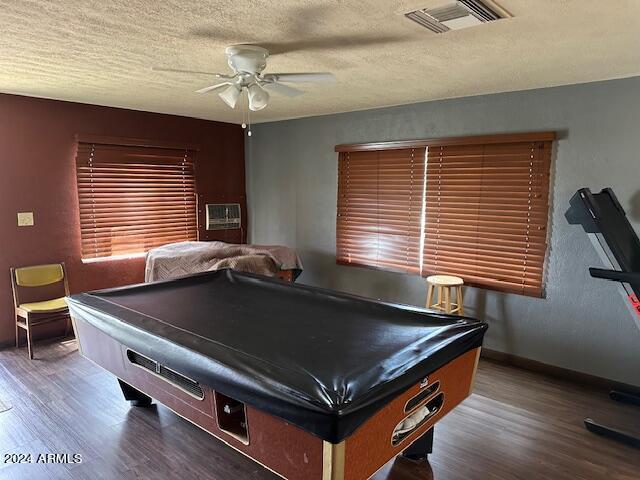 rec room featuring a textured ceiling, hardwood / wood-style flooring, ceiling fan, and pool table