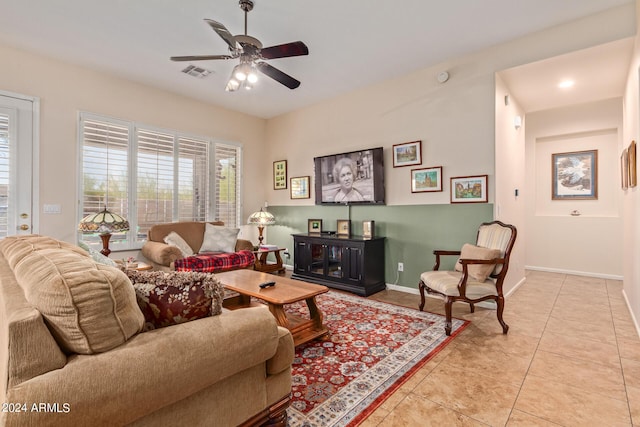 tiled living room featuring ceiling fan