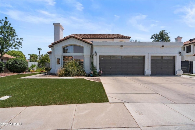 mediterranean / spanish-style home featuring a garage, driveway, a tiled roof, stucco siding, and a front lawn