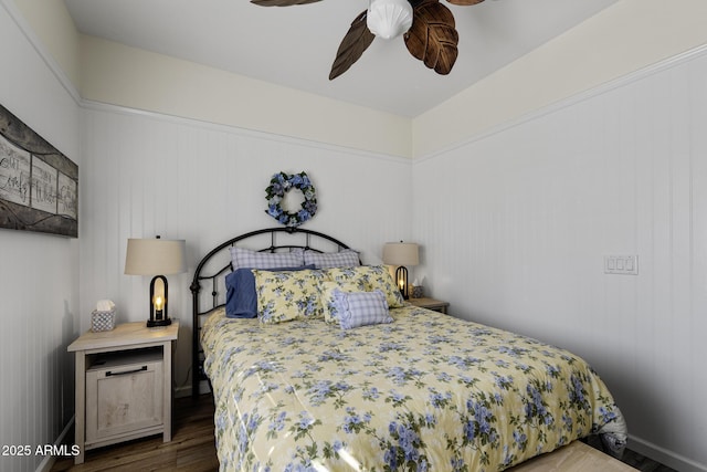 bedroom featuring dark wood-style floors, ceiling fan, and baseboards