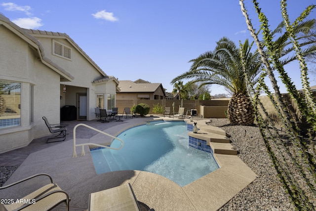 view of pool featuring a fenced in pool, a patio area, and a fenced backyard