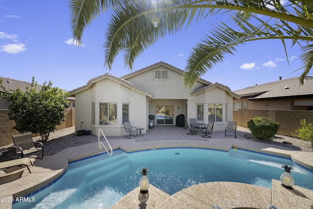 view of pool with a patio area, a fenced backyard, and a fenced in pool