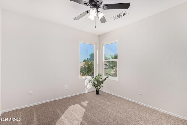 carpeted empty room with ceiling fan