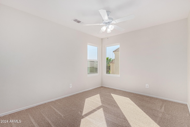 carpeted empty room with ceiling fan