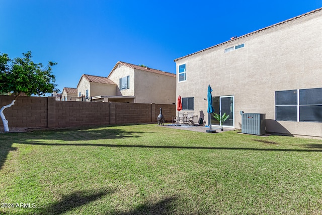 view of yard featuring a patio area and central AC unit