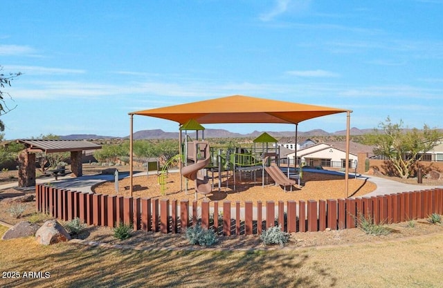 community jungle gym featuring a mountain view