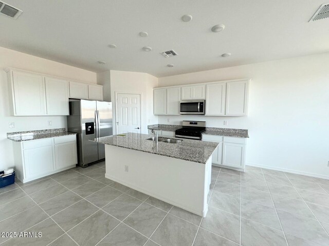 kitchen featuring a sink, stainless steel appliances, and visible vents