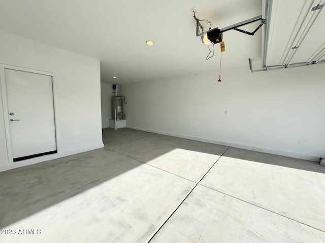 garage featuring recessed lighting, baseboards, a garage door opener, and water heater