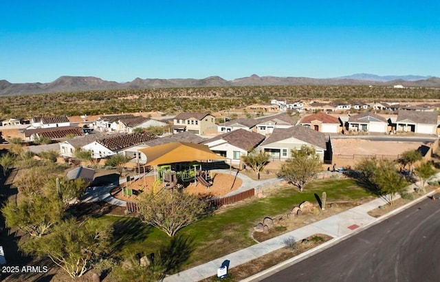 birds eye view of property with a residential view and a mountain view