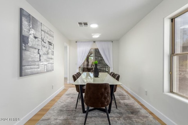 dining area with hardwood / wood-style floors