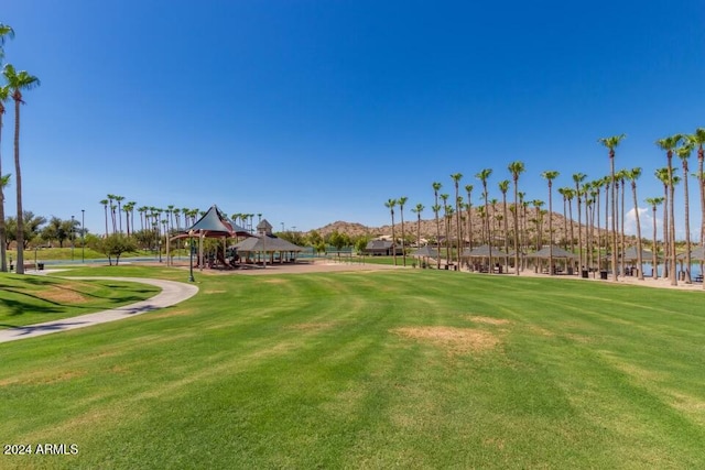 view of home's community with a gazebo and a yard