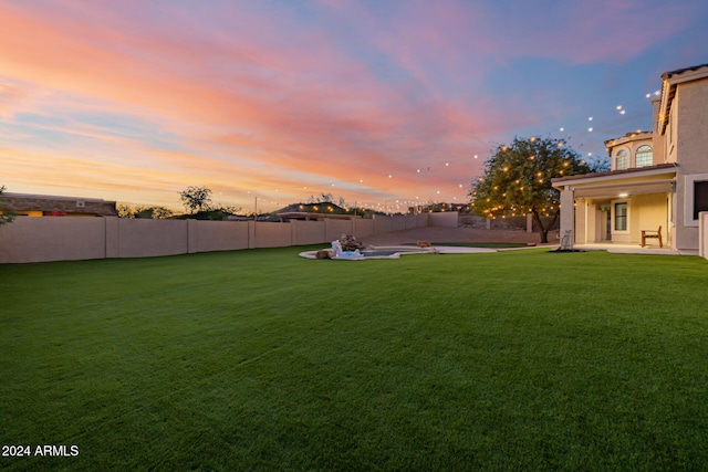 view of yard at dusk