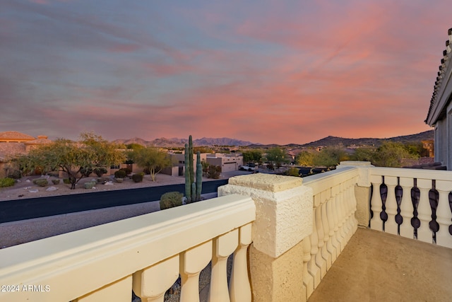 balcony at dusk with a mountain view