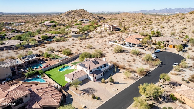 birds eye view of property featuring a mountain view