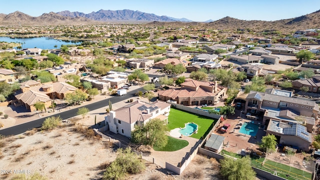 drone / aerial view with a water and mountain view