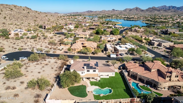 aerial view featuring a water and mountain view