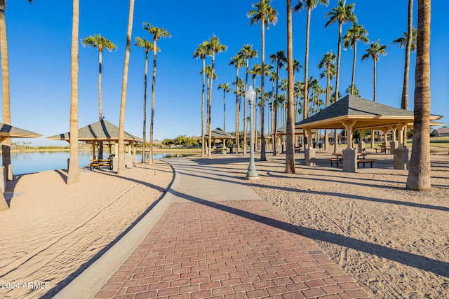 exterior space featuring a gazebo and a water view