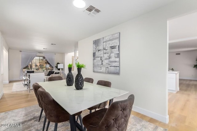 dining area with light wood-type flooring