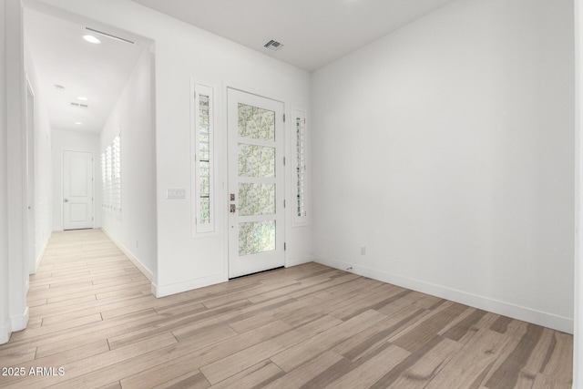 entrance foyer with a healthy amount of sunlight and light wood-type flooring