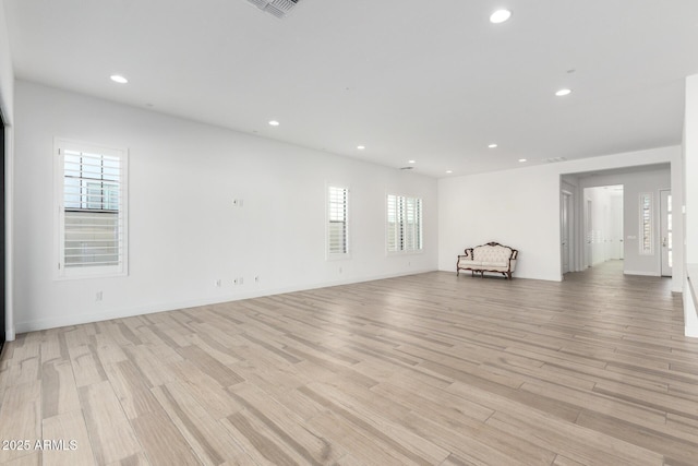 unfurnished living room with light hardwood / wood-style flooring