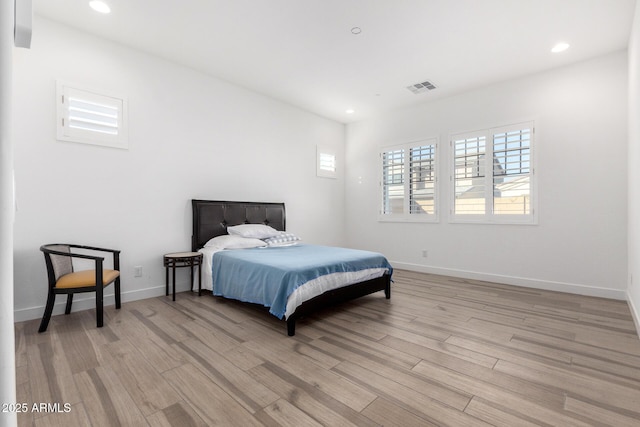 bedroom with light hardwood / wood-style flooring