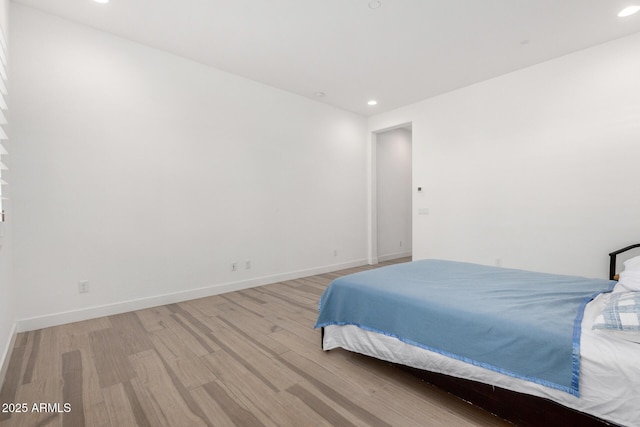 bedroom with light hardwood / wood-style flooring