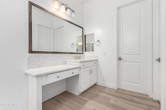 bathroom with vanity and hardwood / wood-style floors