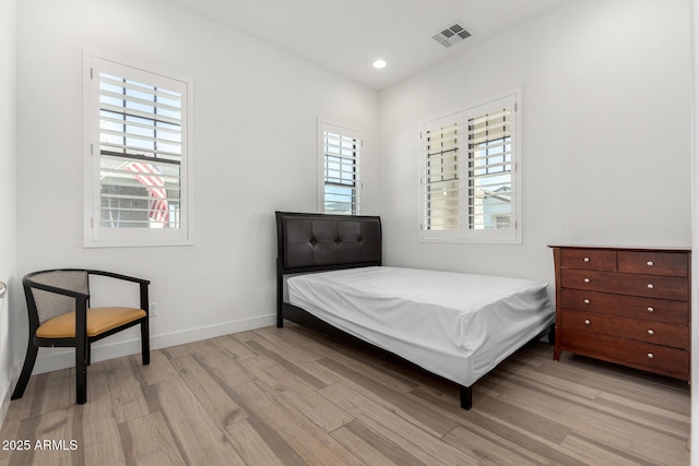 bedroom with light wood-type flooring