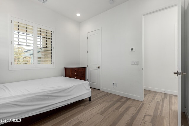 bedroom with light hardwood / wood-style flooring