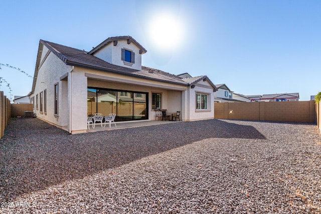 back of property featuring a patio