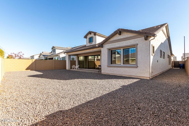 back of property featuring a patio