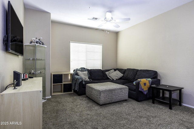 carpeted living area with baseboards, ceiling fan, and visible vents