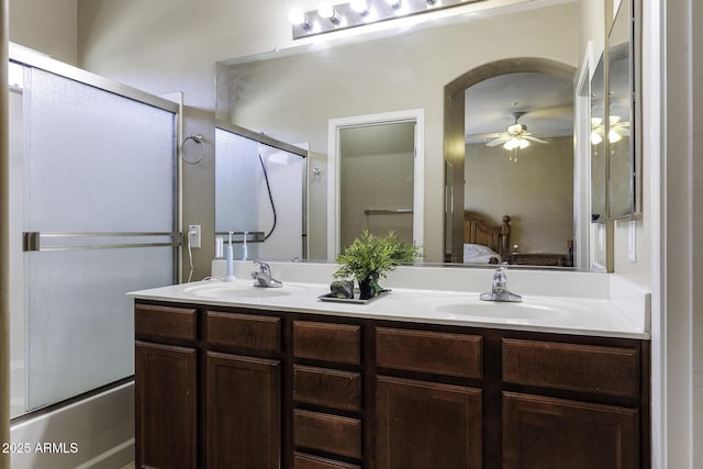 full bathroom with ensuite bathroom, a sink, ceiling fan, and double vanity