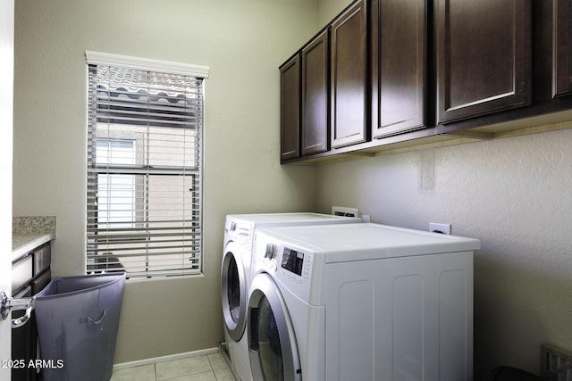 washroom with cabinet space and washing machine and dryer