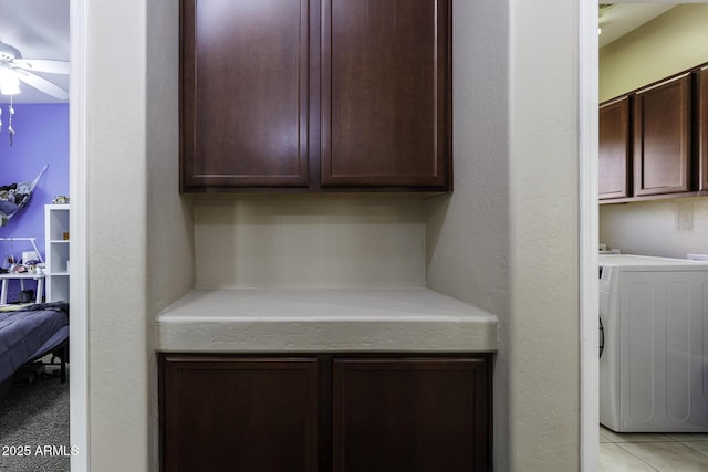 interior space featuring a ceiling fan and washer / clothes dryer