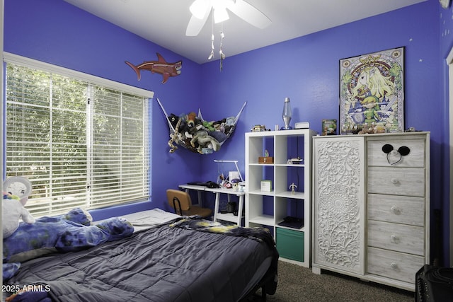 bedroom featuring carpet flooring, ceiling fan, and lofted ceiling