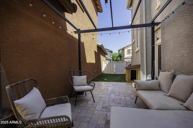 view of patio featuring fence and an outdoor living space