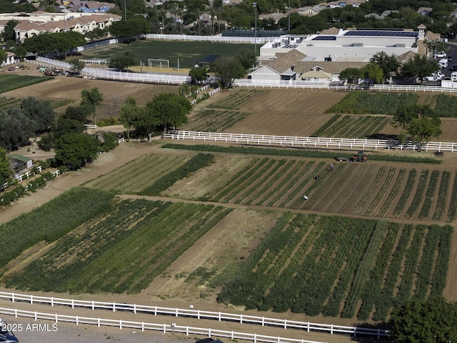 birds eye view of property with a rural view