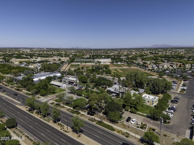birds eye view of property with a mountain view