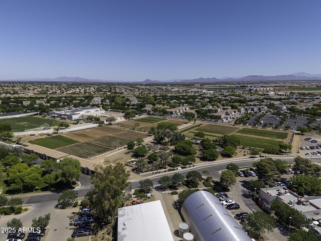birds eye view of property with a mountain view