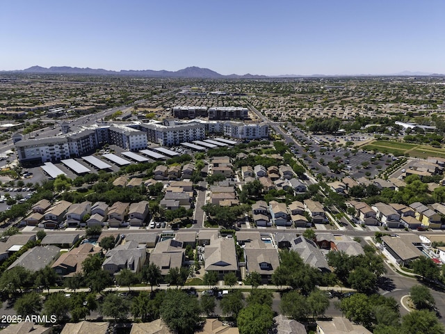 birds eye view of property featuring a mountain view